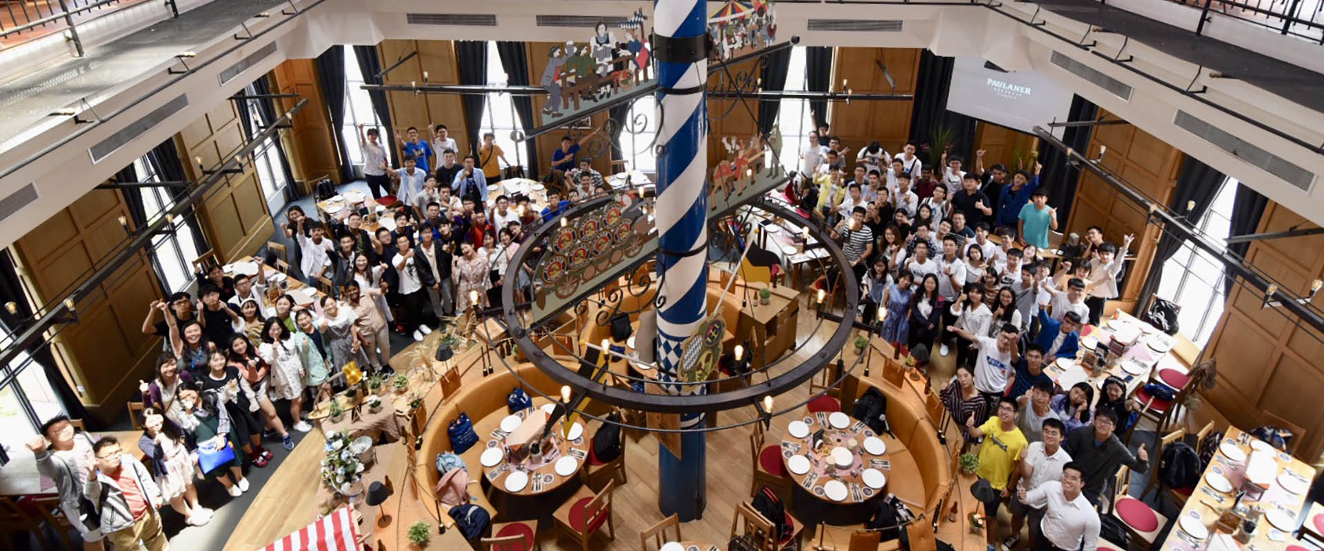 Image of people celebrating at level 2 restaurant of Paulaner Brauhaus Singapore
